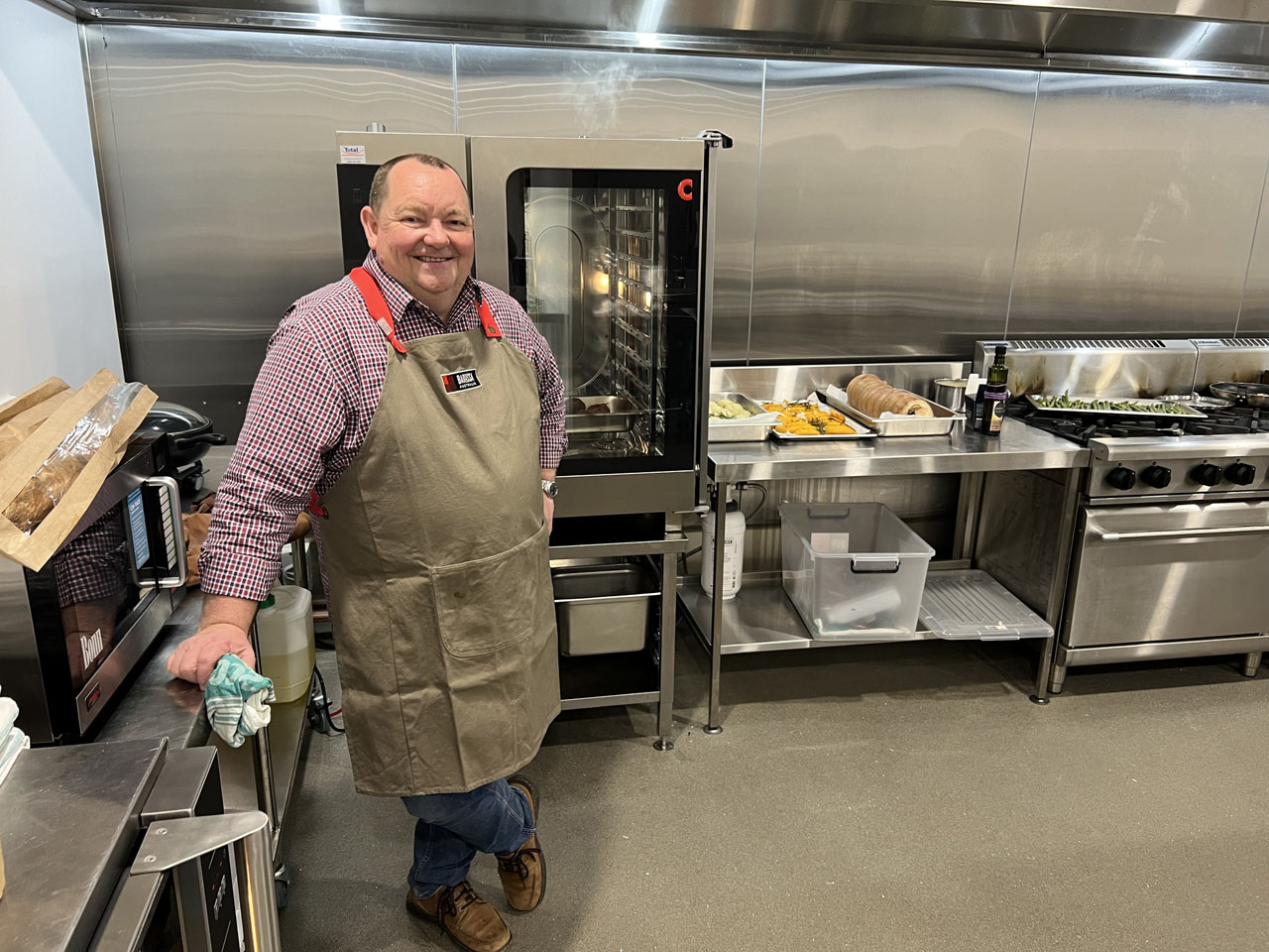 RDA BGLAP Food Projects and Workforce Manager Mark McNamara in front of the oven in the kitchen at Barossa Cellar