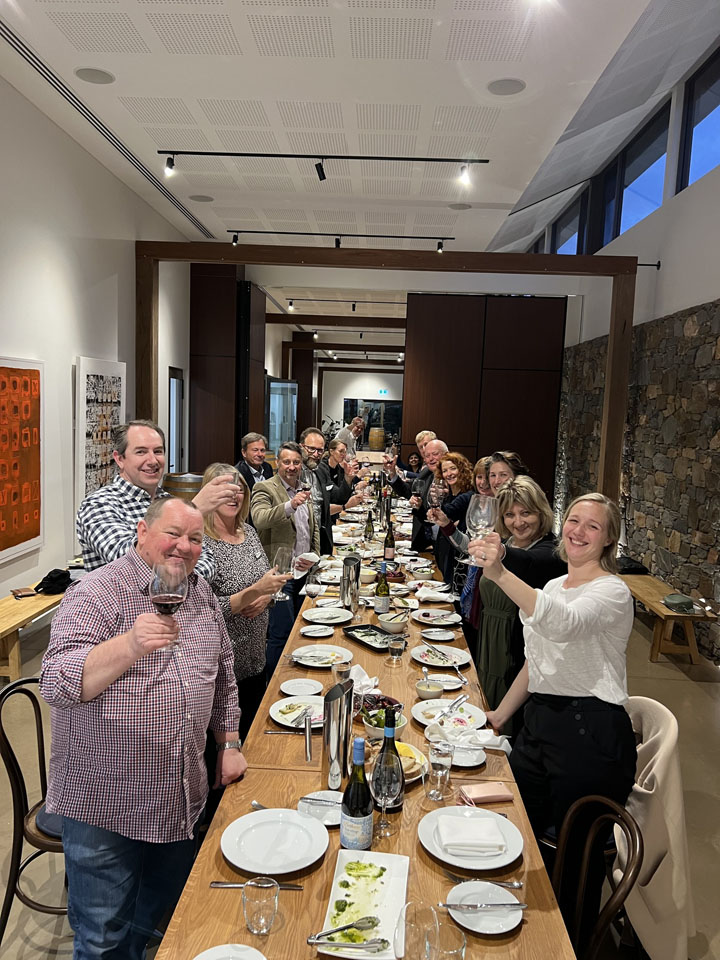 A group of people raise a glass at the AGM