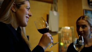 Victoria Miranda from Lou Miranda Wines drinks wine with a friend