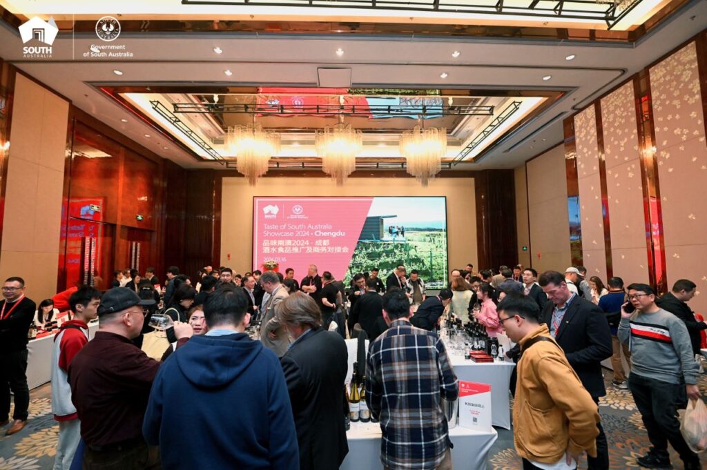 A group of people in a room at the Taste of SA delegation in China