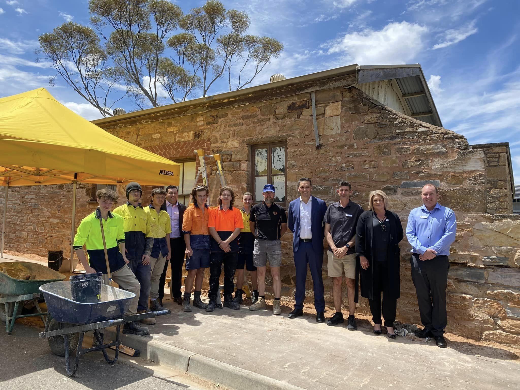 Kapunda High School students and faculty stand in front of school renovations.